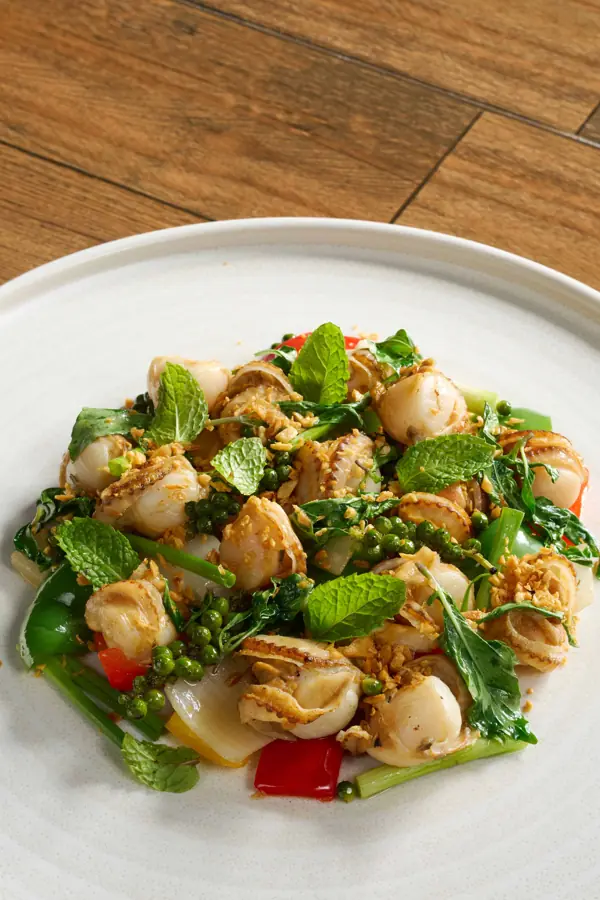Wok-fried scallop and market greens