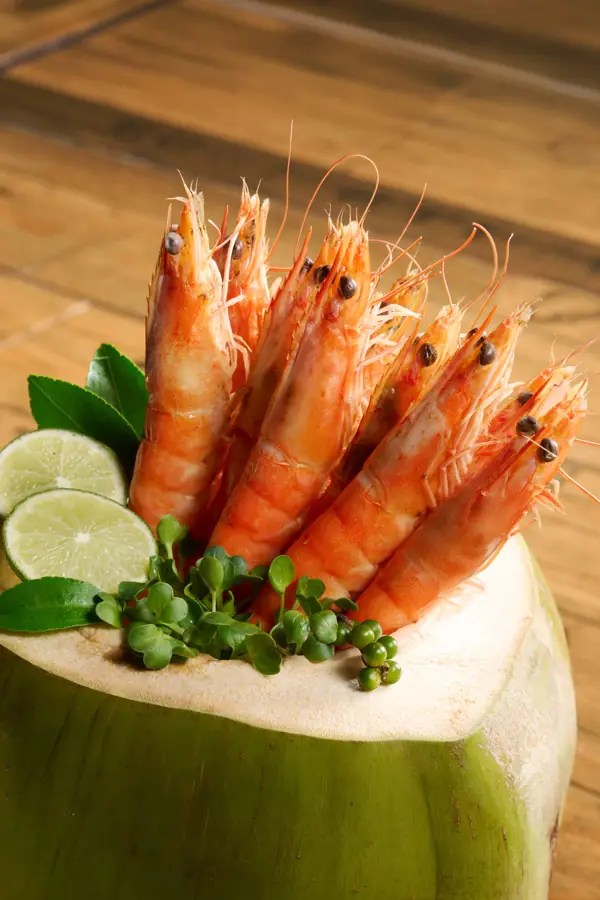 Steamed prawns in a fresh coconut