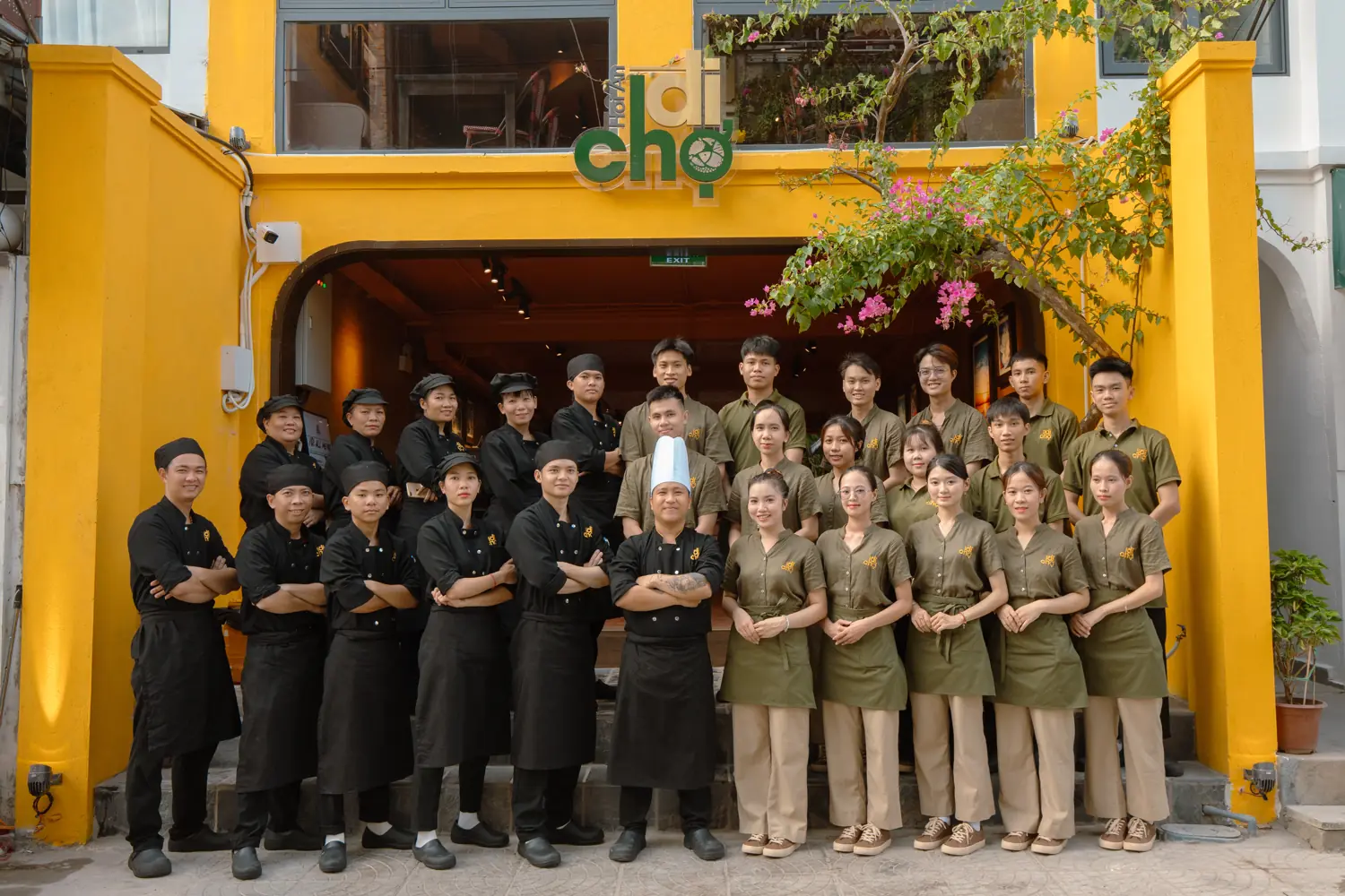 The Đi Chợ team in front of the restaurant